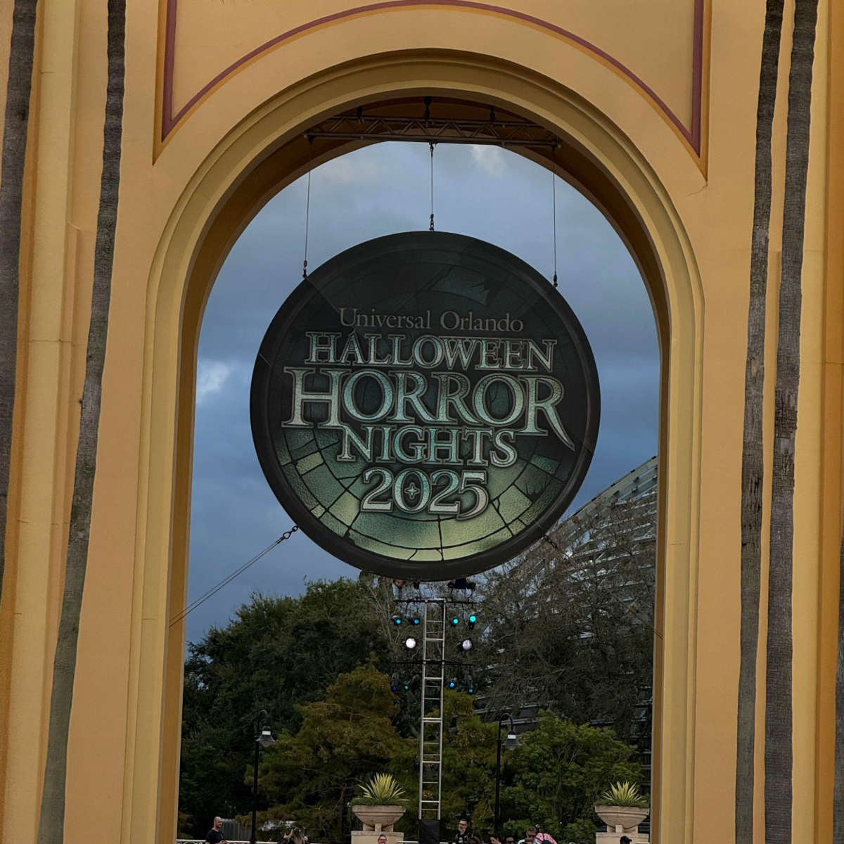“Medallion” Sign for Halloween Horror Nights 2025 Hangs on Universal Studios Orlando’s Entrance.